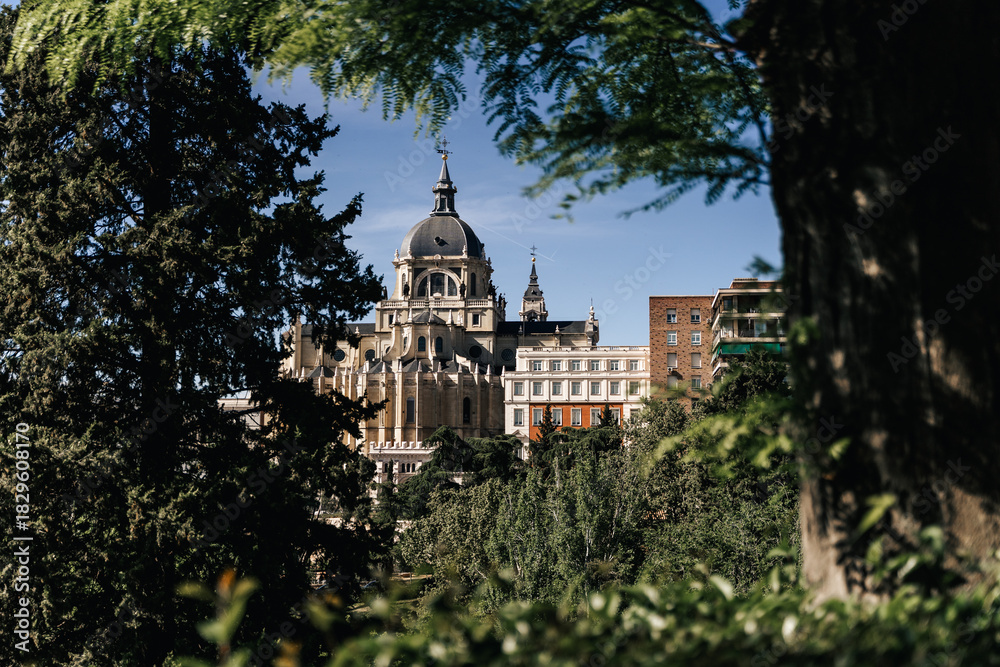 Obraz premium The Almudena Cathedral in Madrid, Spain, showcasing its exterior architecture and grandeur.
