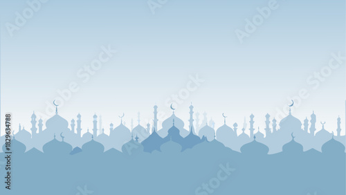 Silhouette of mosques and minarets against blue sky