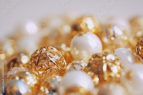 Close-up of a pile of decorative beads, gold and ivory