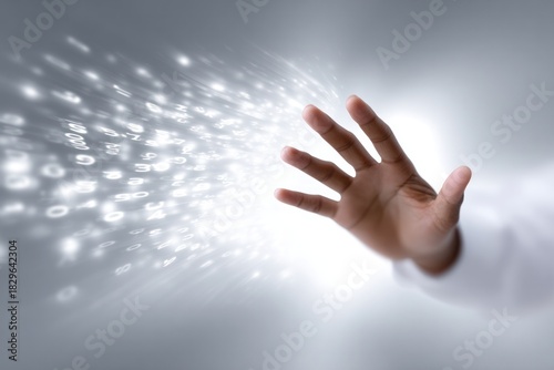 Reaching out: A hand reaching towards a stream of light, symbolizing connection, innovation, and technological advancement. This image is perfect for representing forward-thinking concepts.