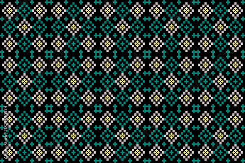 Seamless geometric cross-stitch pattern in green and white on black background. Tribal mosaic style.