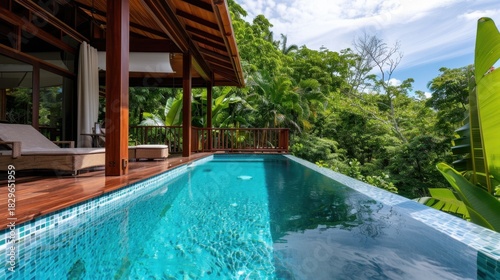 Wallpaper Mural Serene Tropical Villa with Inviting Pool Surrounded by Lush Greenery and Bright Sky Torontodigital.ca