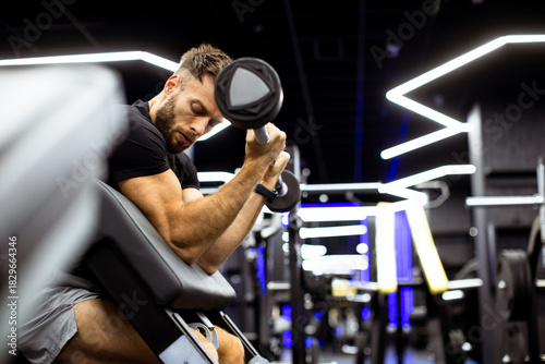 Man performing bicep curls ...