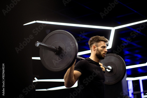 Strong man lifting weights ...