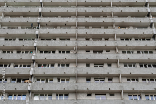 Concrete apartment block facade with repetitive balconies — urban residential architecture