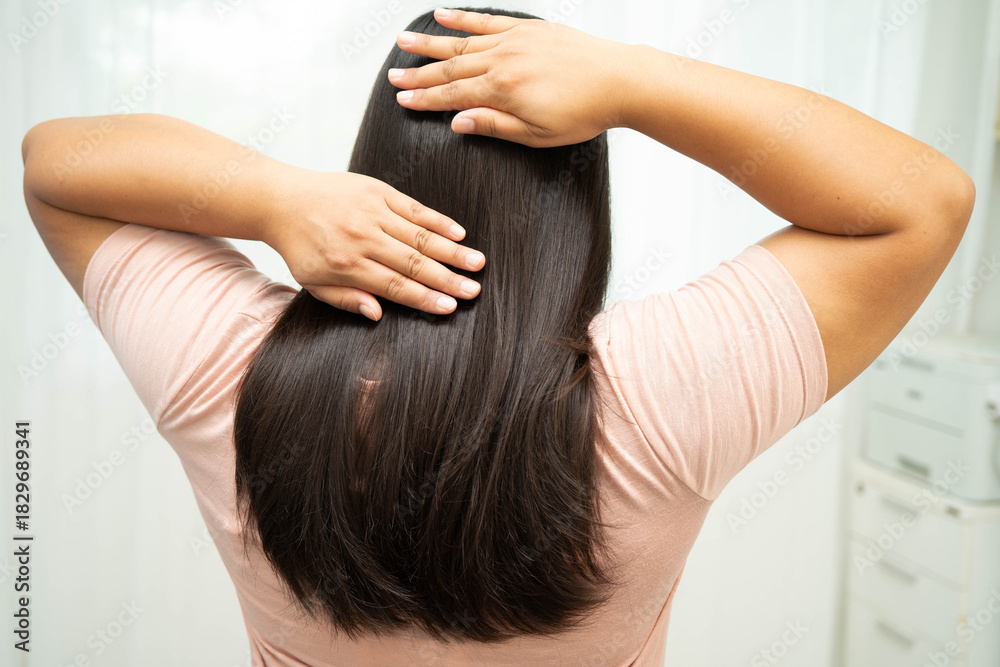 Naklejka premium Woman with beautiful shine hair care treatment.