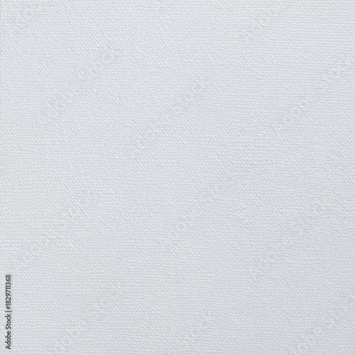 A textured white canvas splattered with vibrant paint splashes in various colors, showcasing an abstract artistic expression and creative energy.