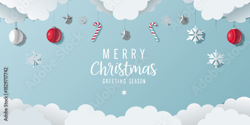 Festive christmas decorations hanging from clouds on a light blue background