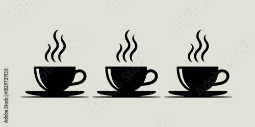 Three steaming black coffee cups and saucers on a light background