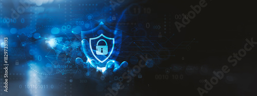 Global Cybersecurity Protection Network, A futuristic cybersecurity concept image featuring a glowing shield with a lock icon, symbolizing digital protection and data security. 