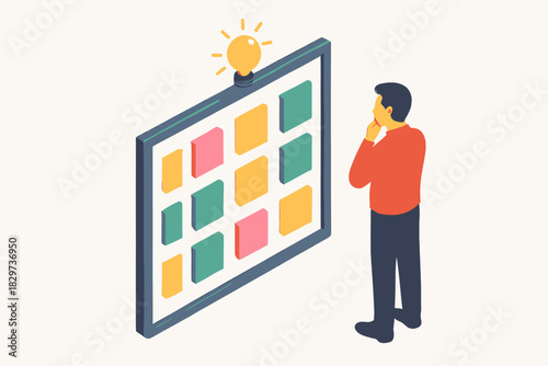 Pensive man contemplates colorful isometric board topped with a glowing lightbulb