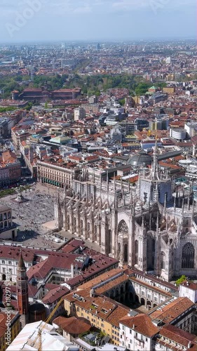 4K aerial vertical video of Milan Cathedral, Duomo di Milano. Cinematic drone footage over Piazza and Sforza Castle. Iconic Italy landmark for travel reels and mobile content.