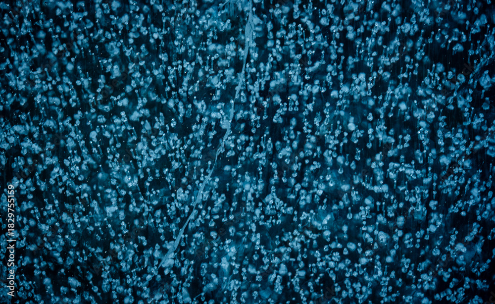 Obraz premium Air Bubbles Locked In The Frozen Water Of Dream Lake In Rocky Mountain