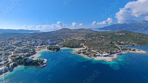 Stunning aerial view of Albania coastline, featuring crystal-clear blue waters, untouched sandy beaches, and natural coastal beauty