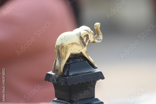 Back picture of a small Golden metallic elephant