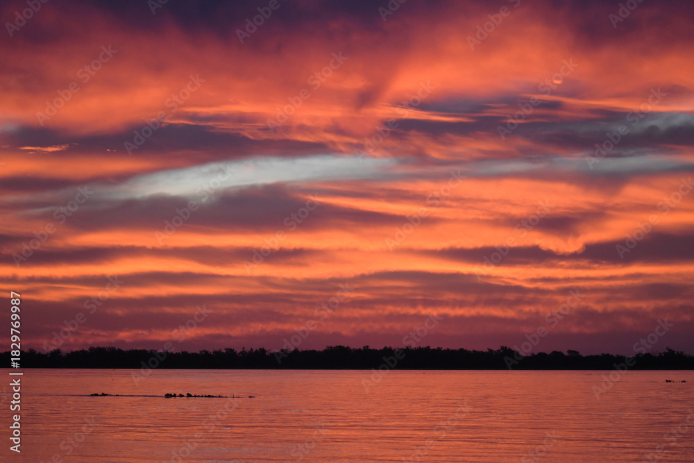 Obraz premium sunset over the river