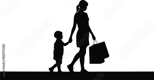 A loving mother holding her childs hand while carrying several shopping bags in silhouette