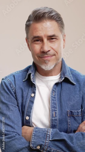 Portrait of happy casual older man smiling, Mid adult, mature age guy with gray hair, Isolated on white background, copy space.
