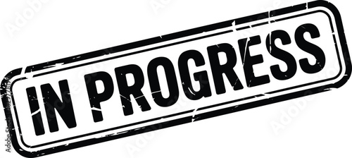 Black in progress stamp with a grunge texture effect is isolated on a clean white background