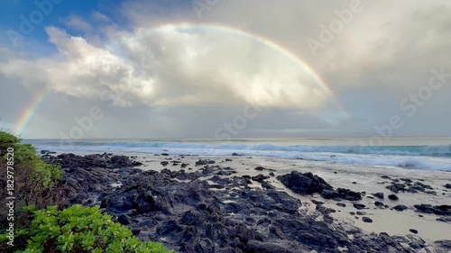 Morning rainbow over the sea along the Kaanapali coastline on the west side of Maui in Hawaii. 