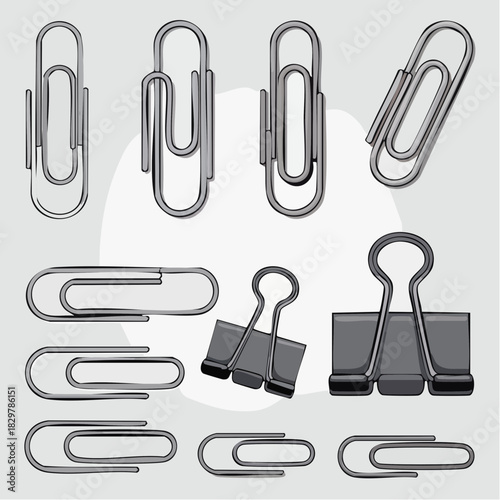 Collection of various metal paper clips and black binder clips on a light grey background.