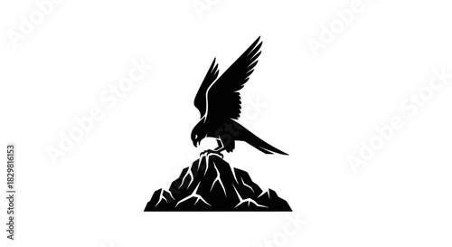 Majestic Falcon Perched Atop Rocky Mountain Peak Silhouette.