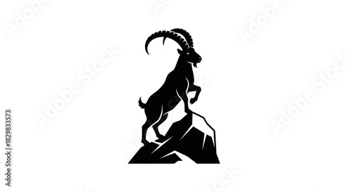 Majestic Ibex Mountain Goat Silhouette Standing on Rocky Peak.