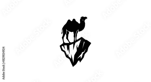Black silhouette of a dromedary camel standing on a rocky mountain peak.