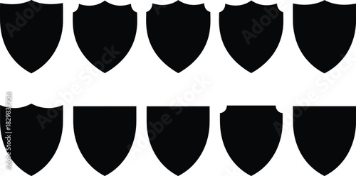 Solid black silhouette vector shields representing security, protection, defense, and various shapes.