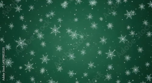 Falling snowflakes on green background winter holiday