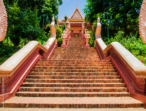 Impressive detail of the main stairway with multi-headed snakes, leading to the Wat Phnom Pagoda, Phnom Penh, Cambodia