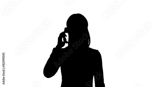 Silhouette of Businesswoman Talking on Mobile Phone: Concept for Communication, Customer Service, and Corporate Connection