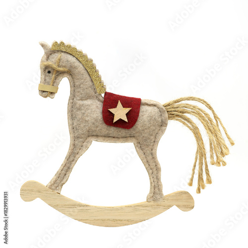 Vintage toy horse  made of wool on a white background. The rocking horse is a classic holiday decoration, perfect for holiday decor and Christmas themes. Vintage holiday illustration.