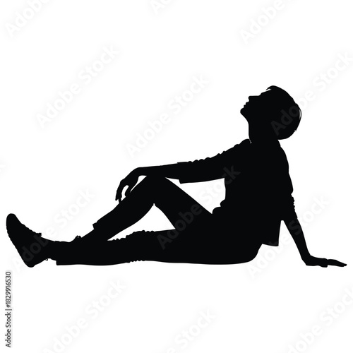 Silhouette of a person reclining against an unseen surface