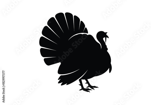 A striking black silhouette of a turkey in profile view