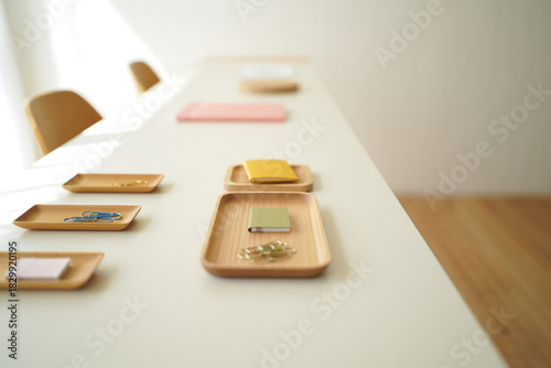 Small Wooden Trays with Stationery Items on White Table Minimalist Office Supplies Arrangement Minimalist Office Workspace 150 Characters