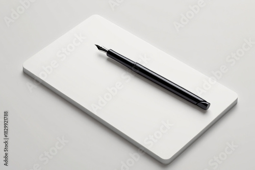 Wallpaper Mural Black Fountain Pen on White Pad Elegant writing tool on white pad minimalist design home office equipment flat lay still life composition Torontodigital.ca