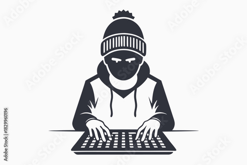 Masked person in front of a computer types on the keyboard quickly