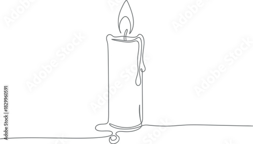 A single lit candle casting a shadow on a white background