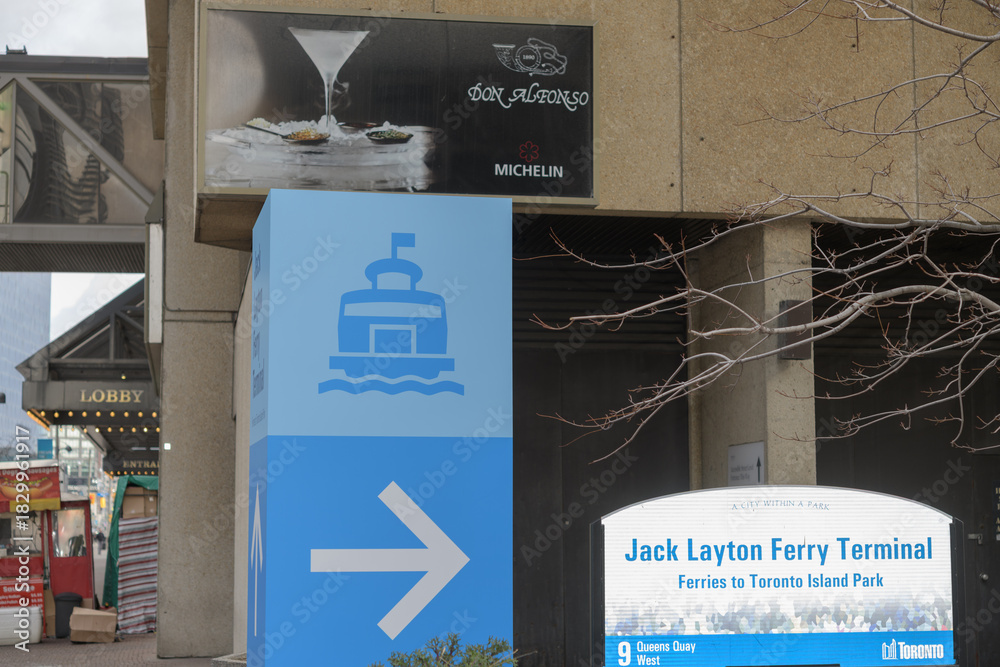 Fototapeta premium sign with directions to Jack Layton Ferry Terminal, 11 Queens Quay W, Toronto