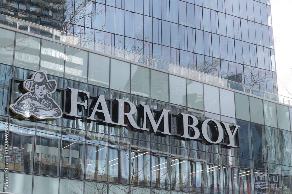 Obraz premium exterior building facade and sign of Farm Boy, a supermarket chain, located here at 100 Queen Quay E, at Sugar Wharf Condominiums, Toronto