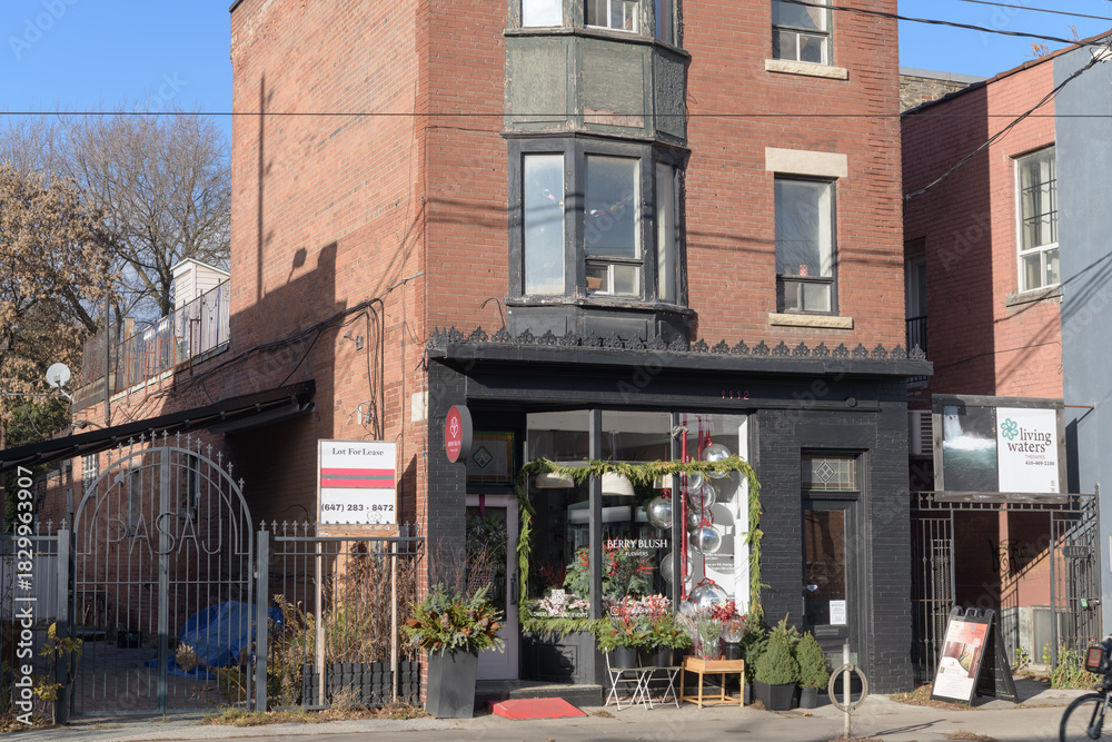 Obraz premium exterior building facade shop front windows and sign of BERRY BLUSH Flowers, 1112 Queen St E, Toronto