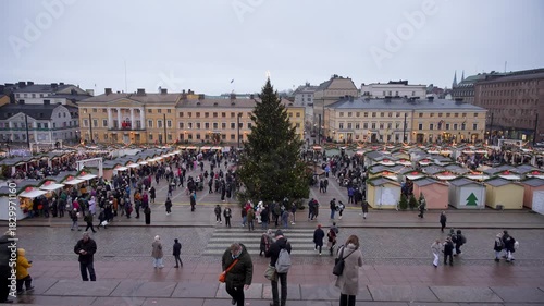 Wallpaper Mural Time-lapse aerial footage of a Finnish Christmas market in 2025, highlighting festive lights, holiday decorations, and busy market activity in a winter setting. Torontodigital.ca