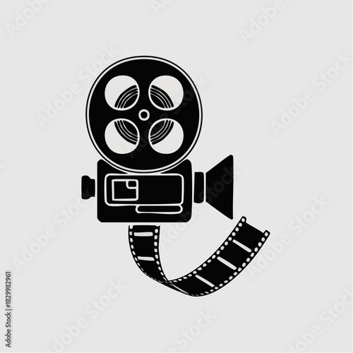A black silhouette of a vintage film camera with a large reel and film strip.