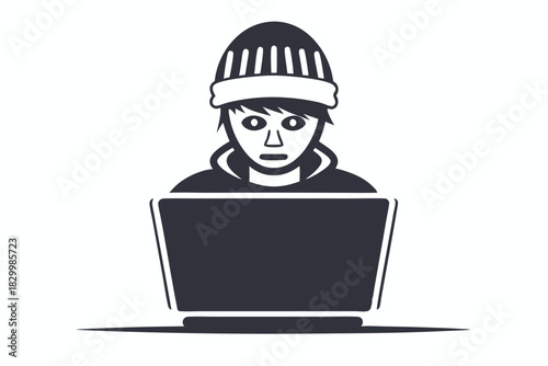 Young man in a beanie looking at code on computer screen with focus