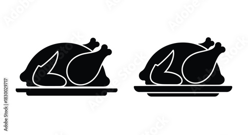 Two roasted chicken silhouettes presented on rectangular serving platters
