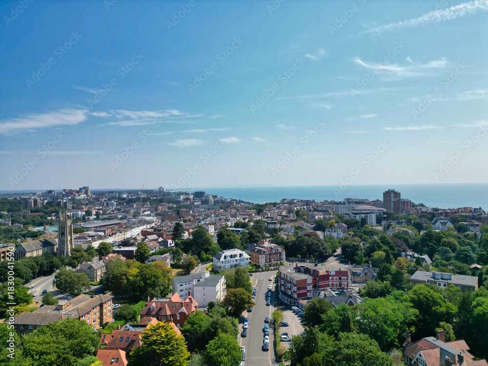 Obraz premium Bournemouth Beach and Ocean City of England. Aerial Footage Was Captured During Hot Sunny Day of 12th, August 2025 With Drone Camera. Bournemouth City is Most Attractive Tourist Attraction of England.