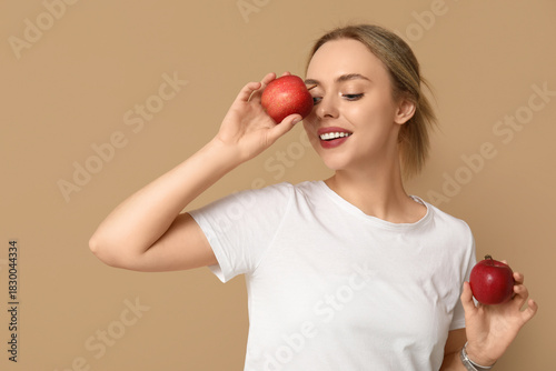 Young woman with apples on ...