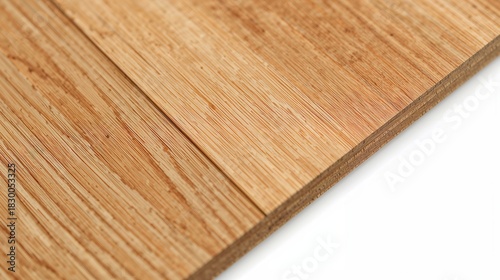 Close up view of laminated plywood, showcasing its layers and natural wood grain pattern.