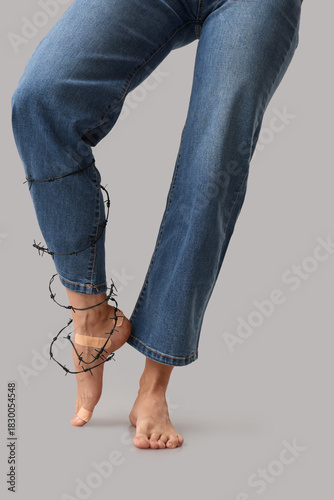 Female legs with plasters a...